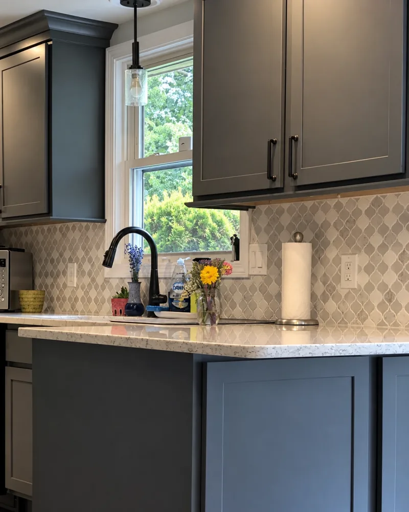 Charcoal cabinets by the garden window