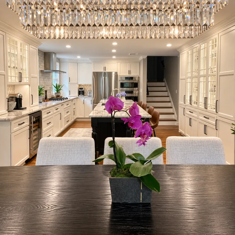 Glass-front cabinet wall and crystal chandelier