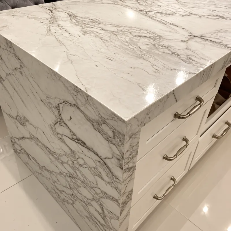 Marble waterfall edge on white drawers