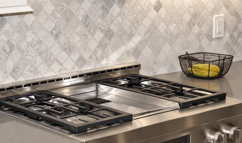 Pro cooktop and marble arabesque tile