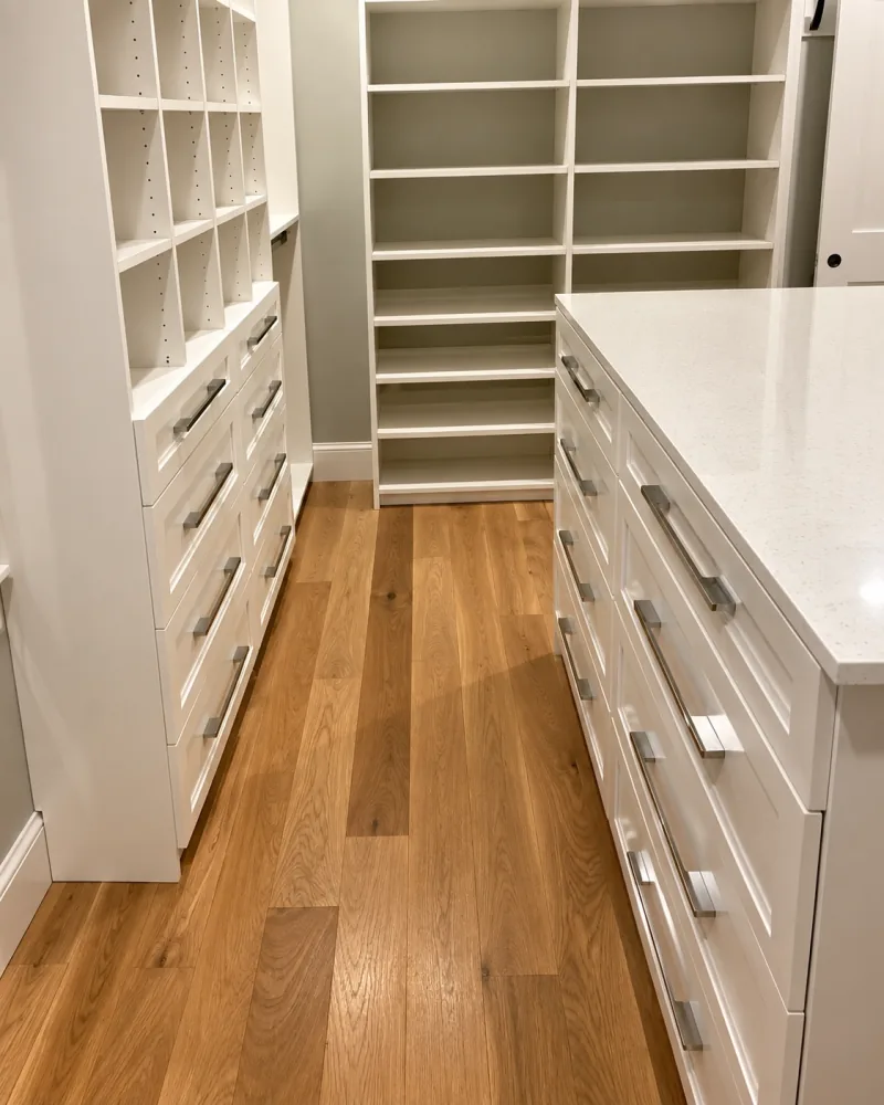 White walk-in closet with center island