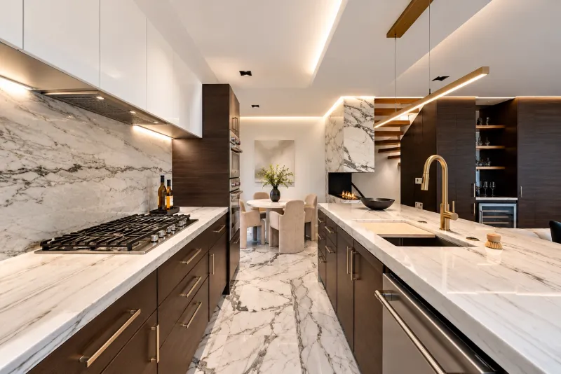 Walnut galley kitchen with marble counters