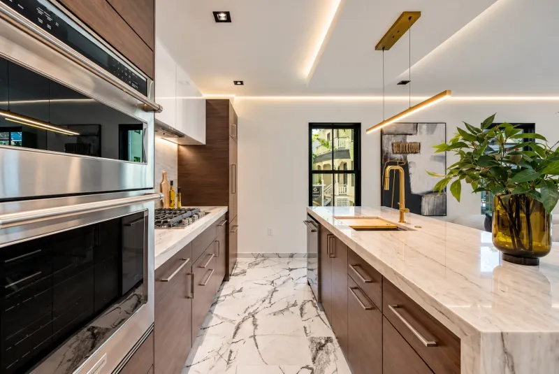 Walnut cabinets and built-in ovens