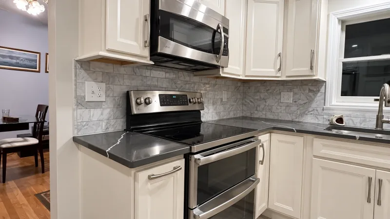 White cabinets with dark quartz counters