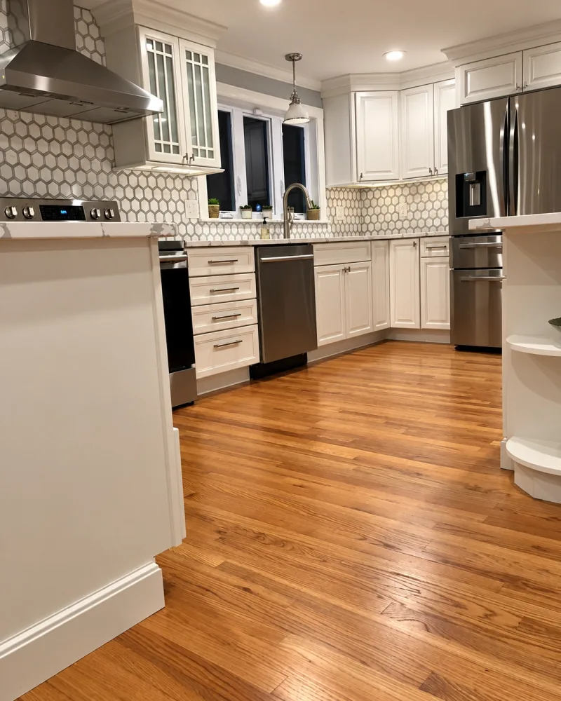 White kitchen with hexagon tile